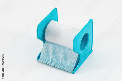 a micropore surgical tape with handle isolated on white background