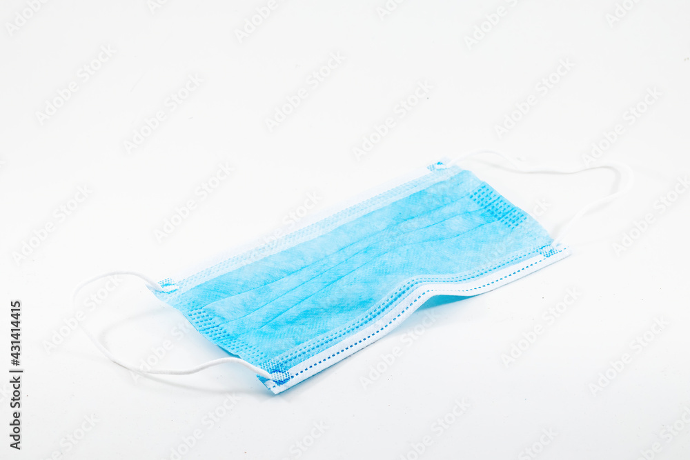 a disposable surgical face mask isolated on white background a disposable surgical face mask isolated on white background