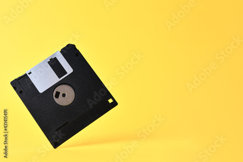 Bilde på lerret Floppy disk on yellow background