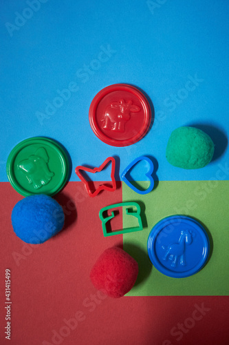 blue and green, red buttons with play toys