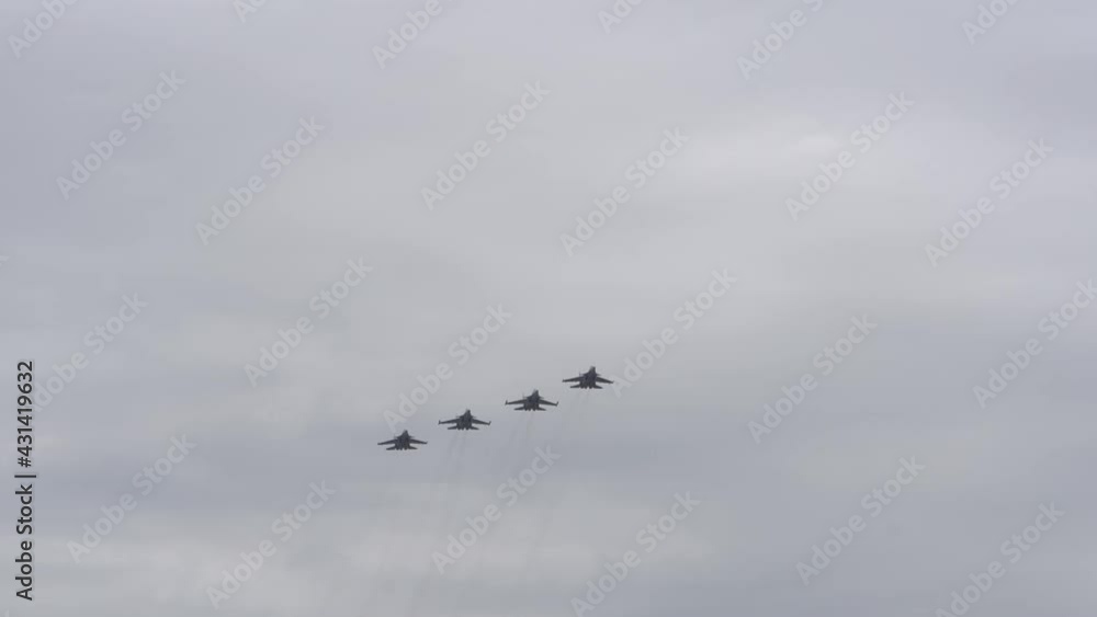 planes flies in the cloudy sky.professional military pilots prepare for a parade