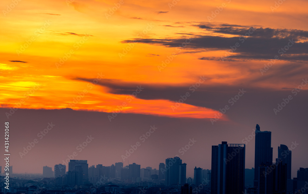 The blurred abstract background of the morning sun exposure to the tiny dust particles that surround the tall buildings in the capital, the long-term health issue of pollution.