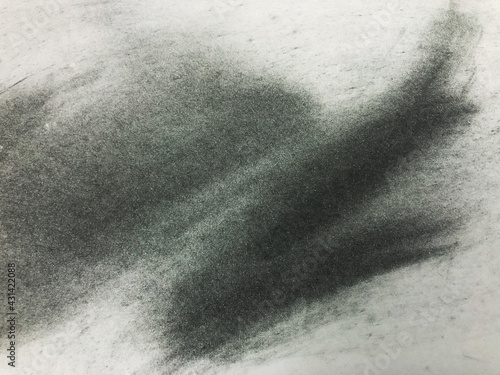 A black background image painted on white paper.