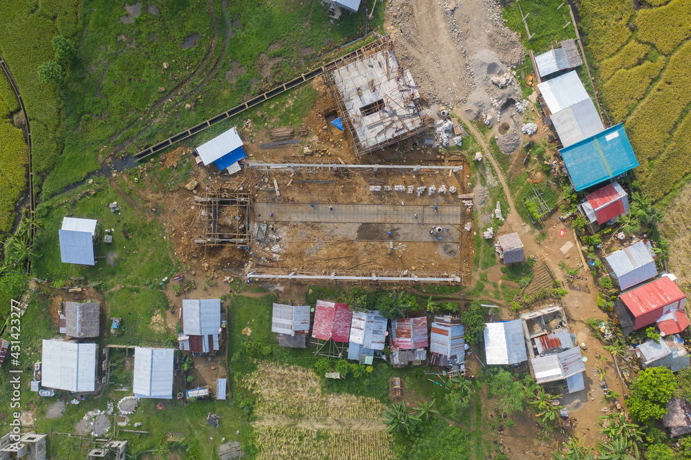 Fototapeta premium Amazing Aerial Drone Shot View of a Construction Site Building in the Provinces Island of the Philippines. Architectural and Industrial Building