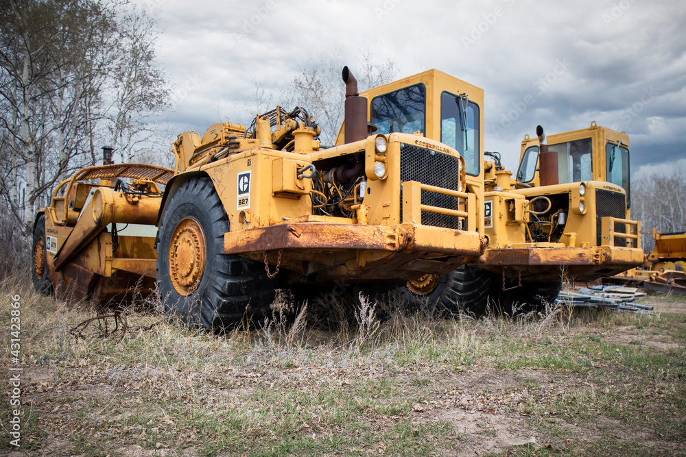 A pair of old 627 scaper's sitting in a field rusting away. Lots of history. Lots of stories. A pair of old 627 scaper's sitting in a field rusting away. Lots of history. Lots of stories.