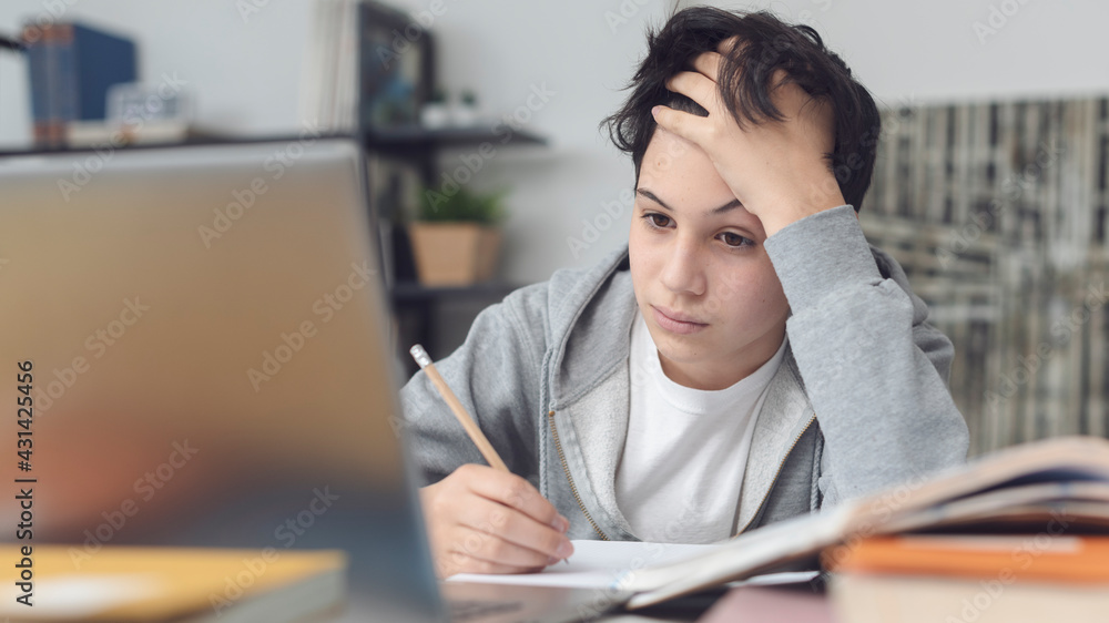 Tired student taking online classes Tired student taking online classes