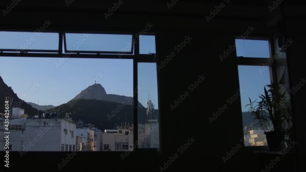 Evening window view of Christ the redeemer in Rio de Janeiro, Brazil Evening window view of Christ the redeemer in Rio de Janeiro, Brazil