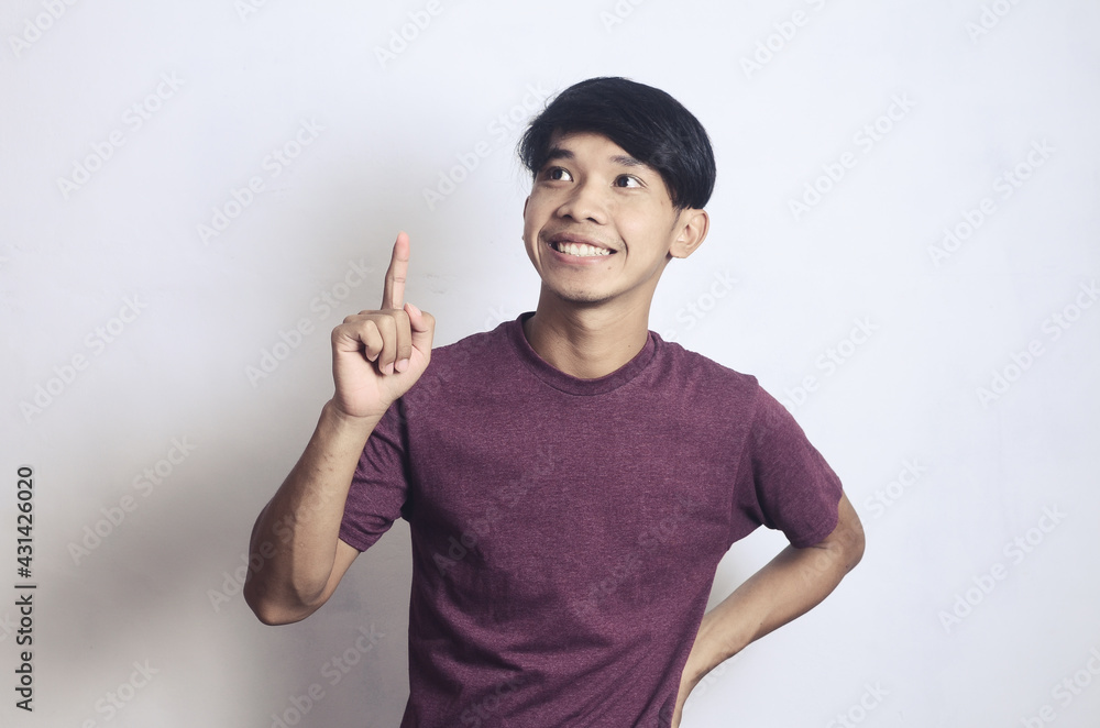 a young Asian man with a happy cheerful expression on a white background a young Asian man with a happy cheerful expression on a white background