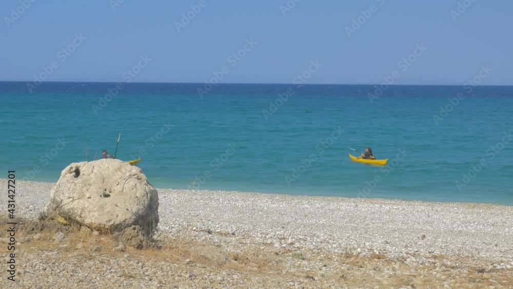 kayak leaving a beautiful beach kayak leaving a beautiful beach