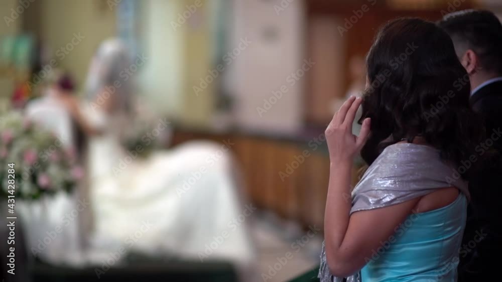 Woman Touching her hair in a wedding church Woman Touching her hair in a wedding church