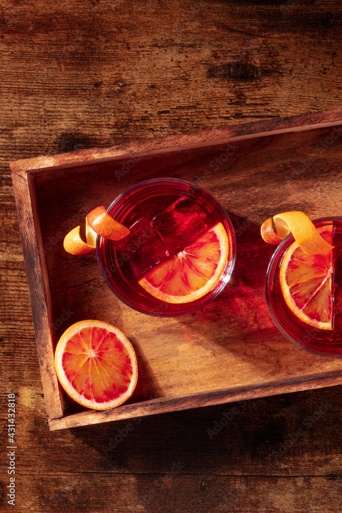 Negroni cocktail with blood oranges and copy space Negroni cocktail with blood oranges and copy space