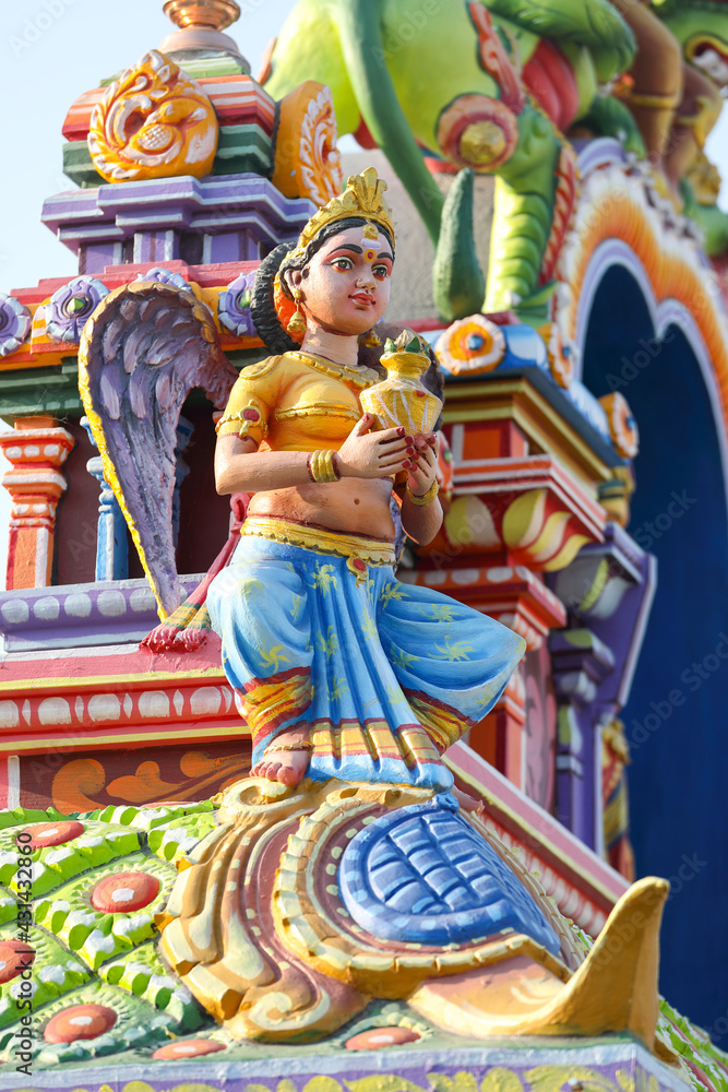 Beaituful Angel statue on hindu temple tower