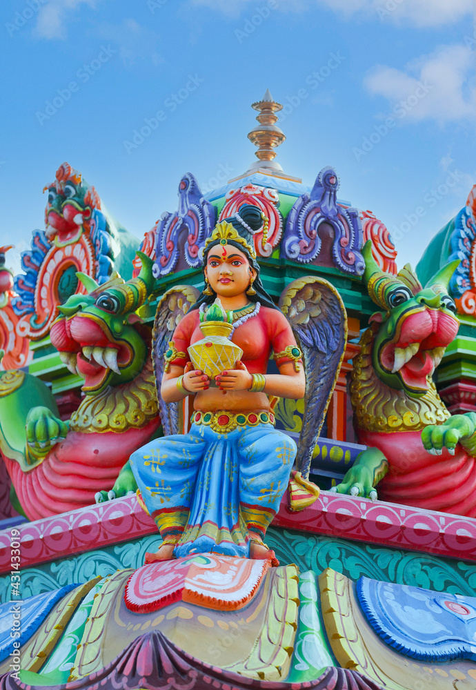 Beaituful Angel statue on hindu temple tower	
