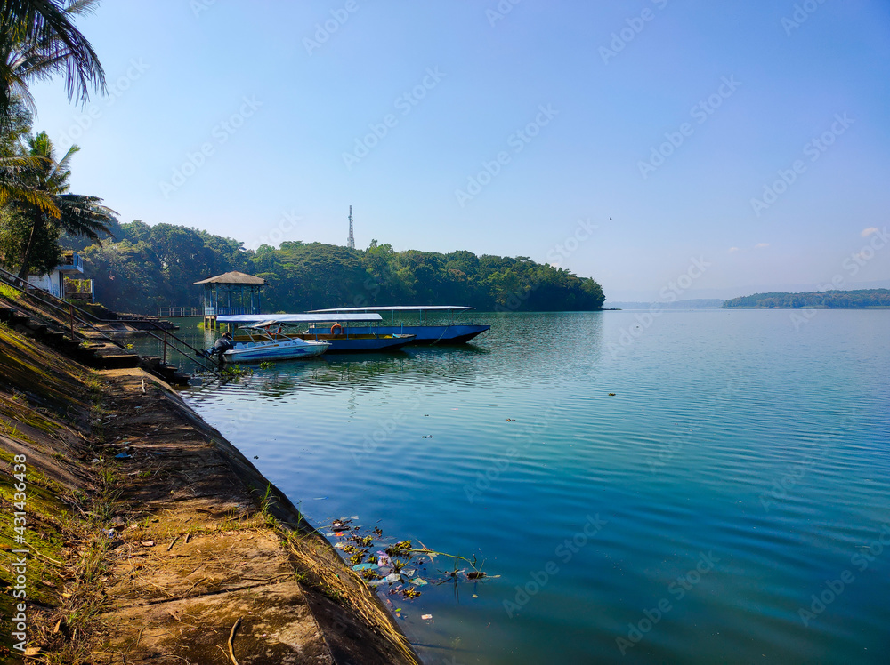 Fototapeta premium patrol boat on Indonesia's natural artificial lake