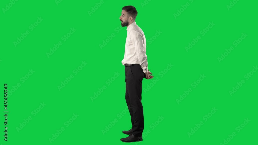 Side view of business man watching seminar with shaking head disagreement. Full length on green screen chroma key background. Side view of business man watching seminar with shaking head disagreement. Full length on green screen chroma key background.