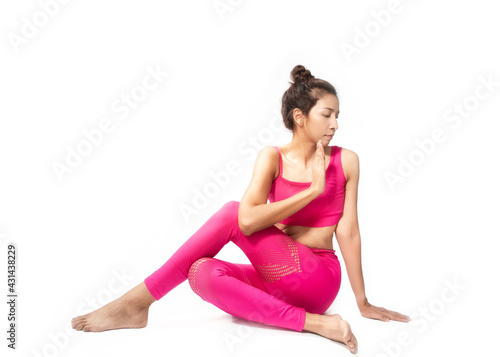 Sporty healthy woman sitting doing yoga exercise in asana pose in studio, doing breathing exercises, Healthy people and self motivation concept.