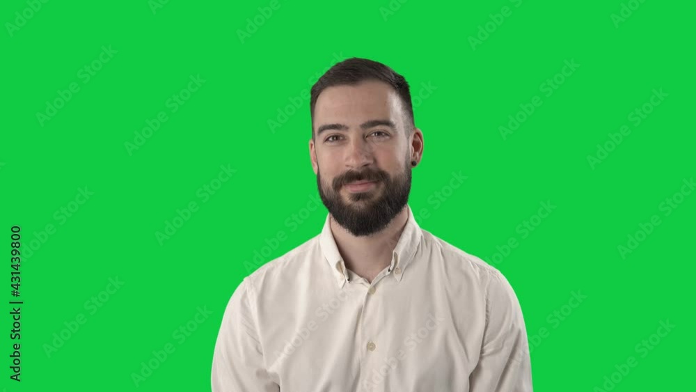 Side view of happy business man looking away then turning and smiling at camera. Portrait on green screen background. Side view of happy business man looking away then turning and smiling at camera. Portrait on green screen background.