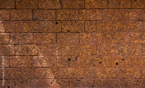 laterite background of old brick wall texture. photo