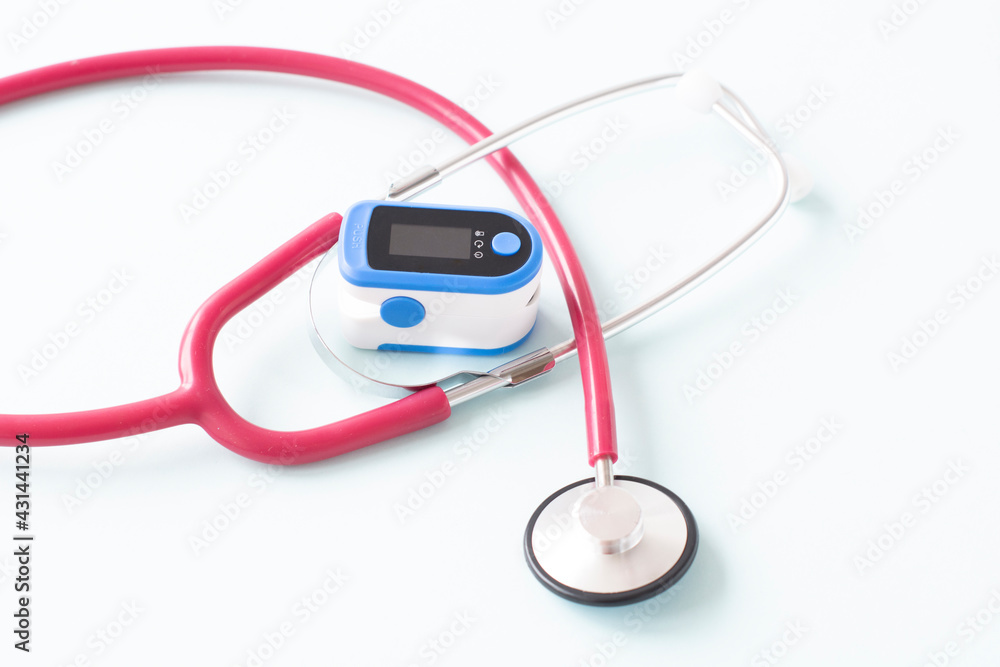Pulse Oximeter, finger digital device to measure person's oxygen saturation and a stethoscope