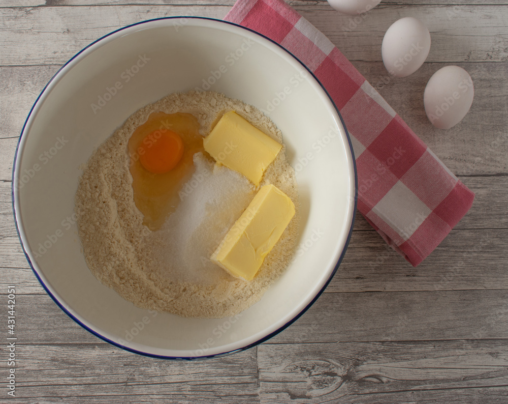 Ingredients for a dough in a bowl Ingredients for a dough in a bowl