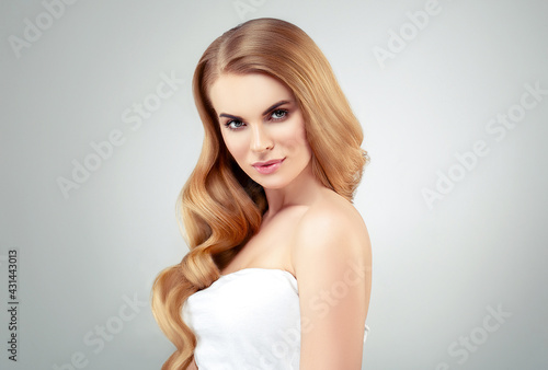 Beautiful woman with long blonde hairstyle healthy beauty skin natural make up