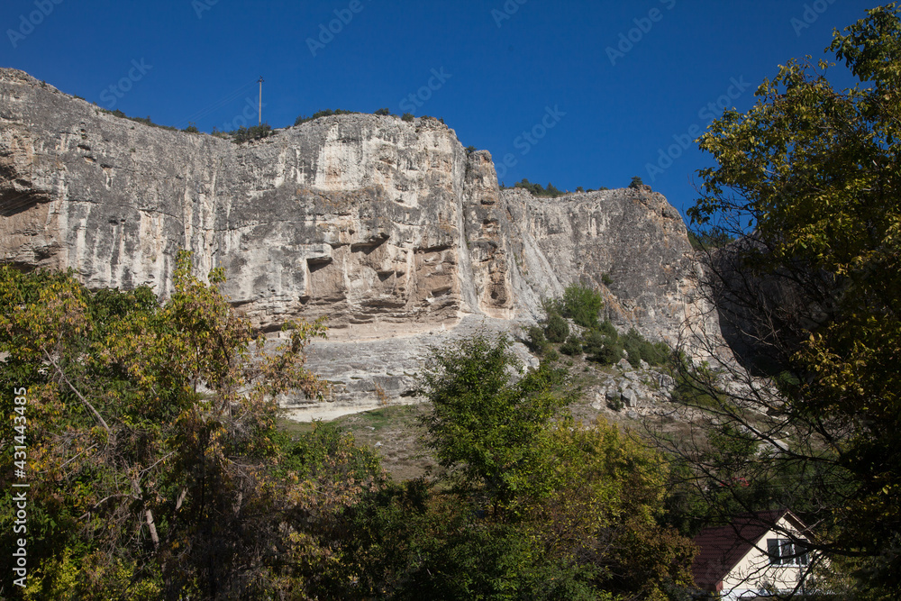 Rocks in the vicinity of Bakhchisarai in the Crimea against the blue sky in summer. Travel concept.