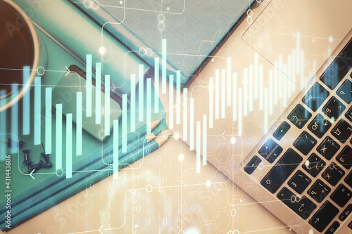 Double exposure of forex graph drawing over desktop background with computer. Concept of financial analysis. Top view.