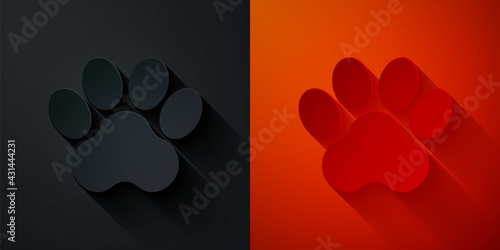 Paper cut Paw print icon isolated on black and red background. Dog or cat paw print. Animal track. Paper art style. Vector