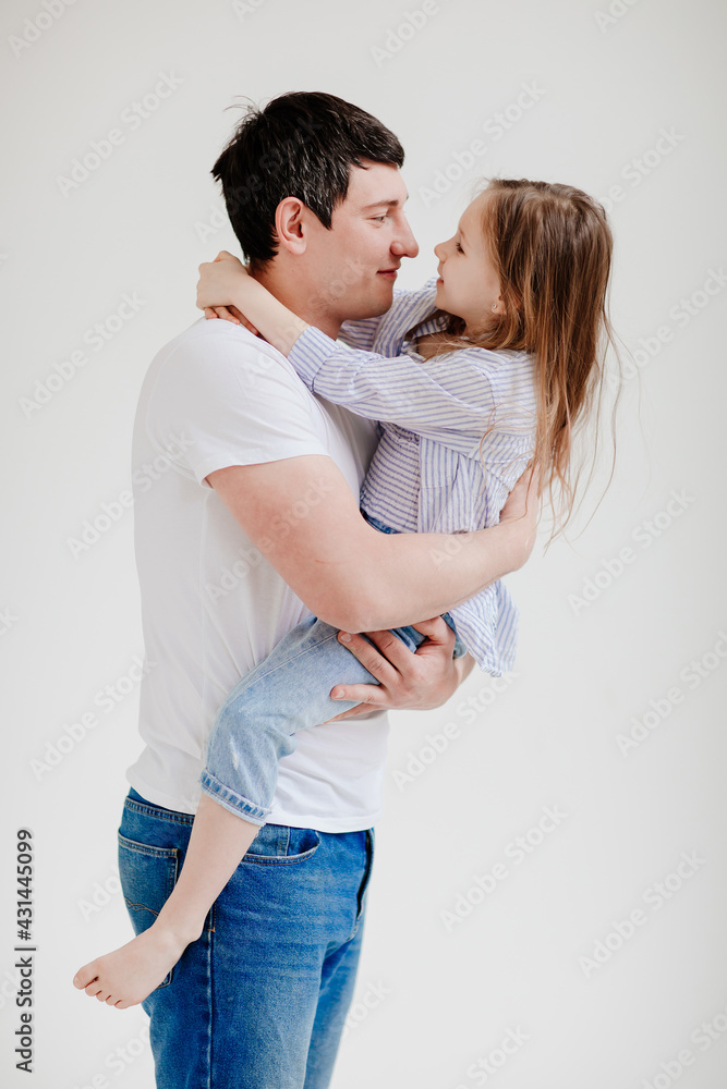 little daughter cuddling and having fun with dad. Happy family. little daughter cuddling and having fun with dad. Happy family.