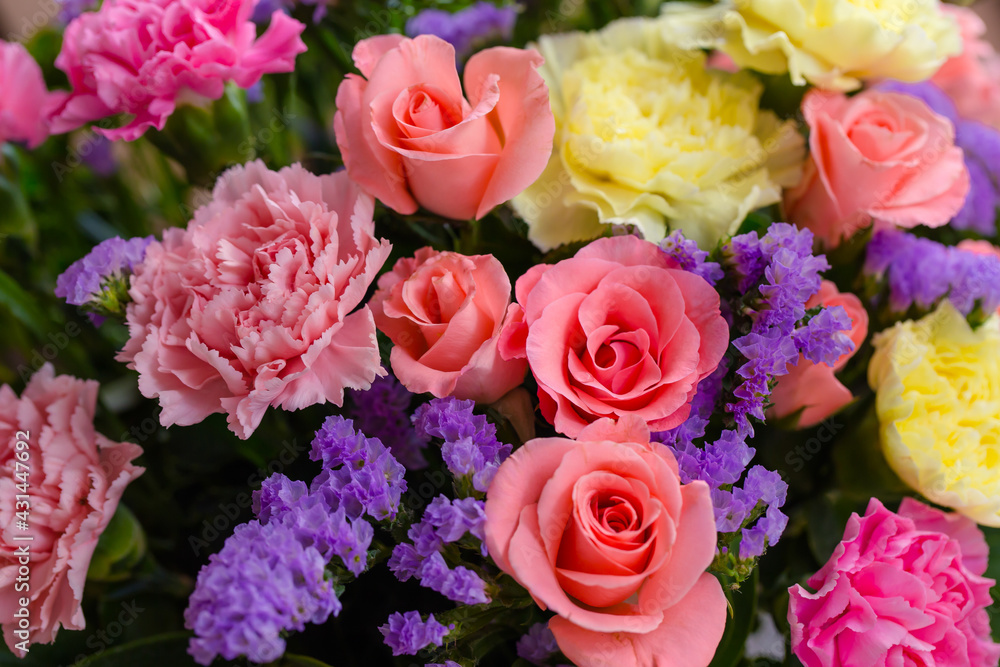 Flowers arranged in a roman vase.