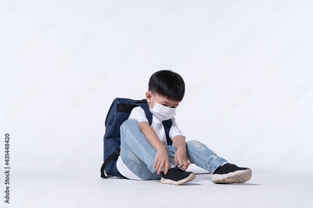 Asian boy about 4 years old wearing chemical face mask and student backpack Asian boy about 4 years old wearing chemical face mask and student backpack