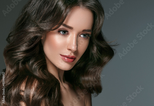 Long hairwoman beautiful face young female  model over dark background