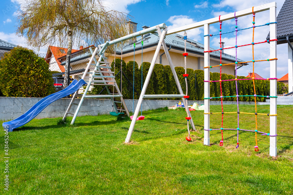 Garden playground for children with a climbing net Garden playground for children with a climbing net