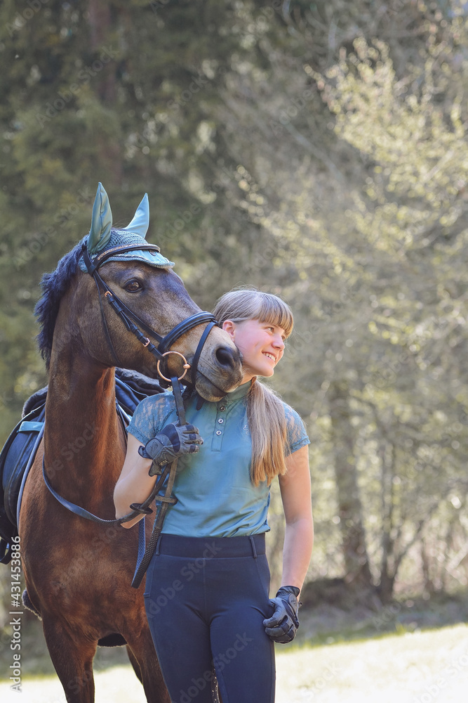 Obraz premium Mädchen mit Reitpony