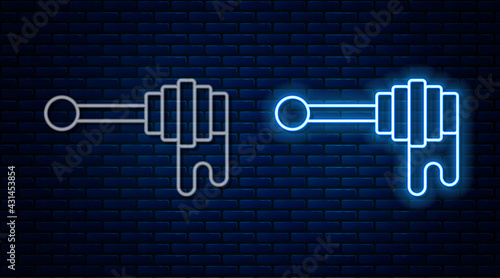 Glowing neon line Honey dipper stick with dripping honey icon isolated on brick wall background. Honey ladle. Vector