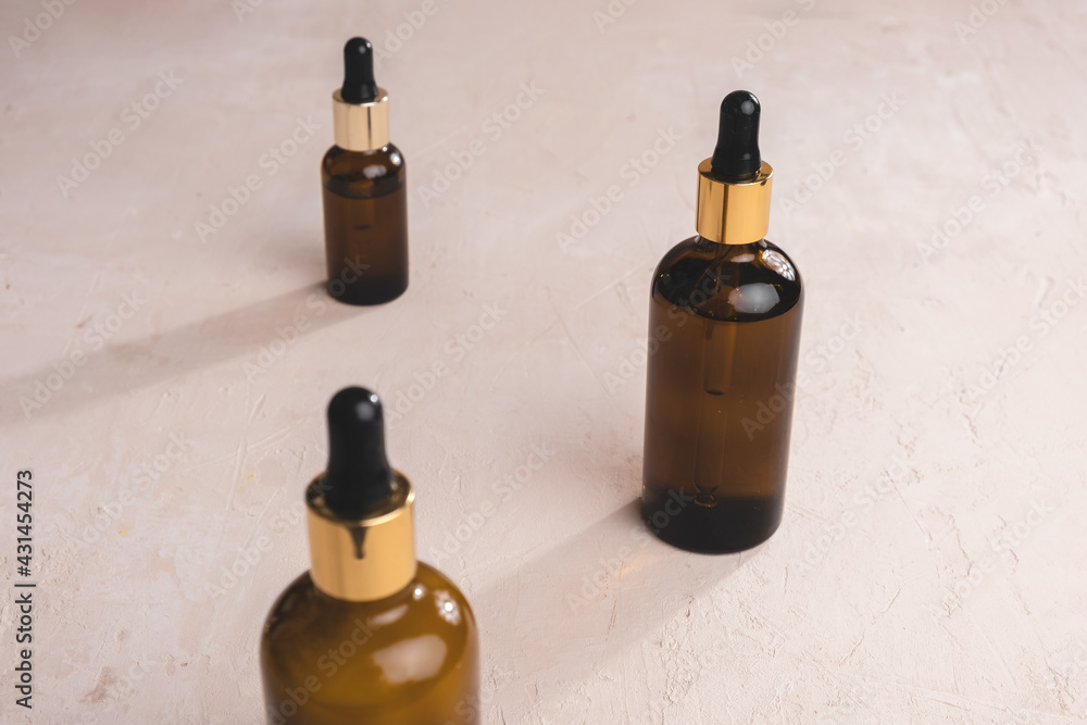 Eco Mineral oil in Amber glass bottles with pipette. Transparent hyaluronic serum gel and skin care concept. Top horizontal view copyspace of dropper glass. Eco Mineral oil in Amber glass bottles with pipette. Transparent hyaluronic serum gel and skin care concept. Top horizontal view copyspace of dropper glass.