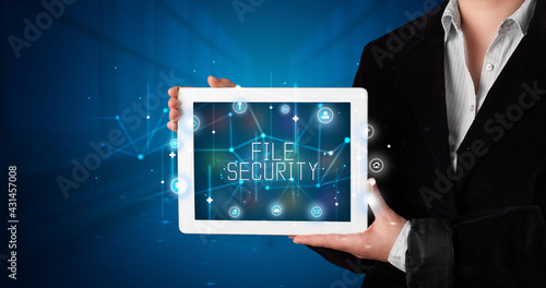 Wallpaper Mural Person holding tablet, security concept Torontodigital.ca