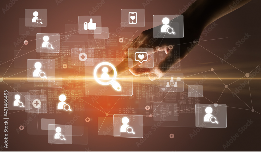 Hand pressing social media multimedia application screen with media icons on futuristic concept Hand pressing social media multimedia application screen with media icons on futuristic concept