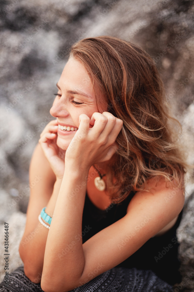 Beautiful laughing smiling woman with closed eyes, vertical shot Beautiful laughing smiling woman with closed eyes, vertical shot