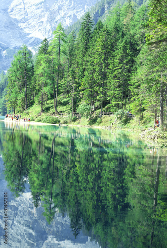 Nature reserve in the Dolomites in South Tyrol  Italy .Fanes-Sennes-Prags Nature Park . UNESCO World Heritage Dolomites . People walking along Pragser Wildsee lake