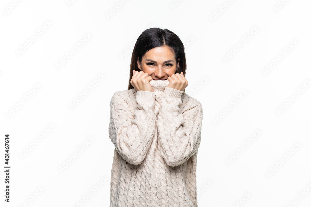 beautiful happy young woman wearing a high neck sweater, against white background beautiful happy young woman wearing a high neck sweater, against white background