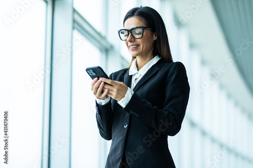 Young business woman use smart phone in the office