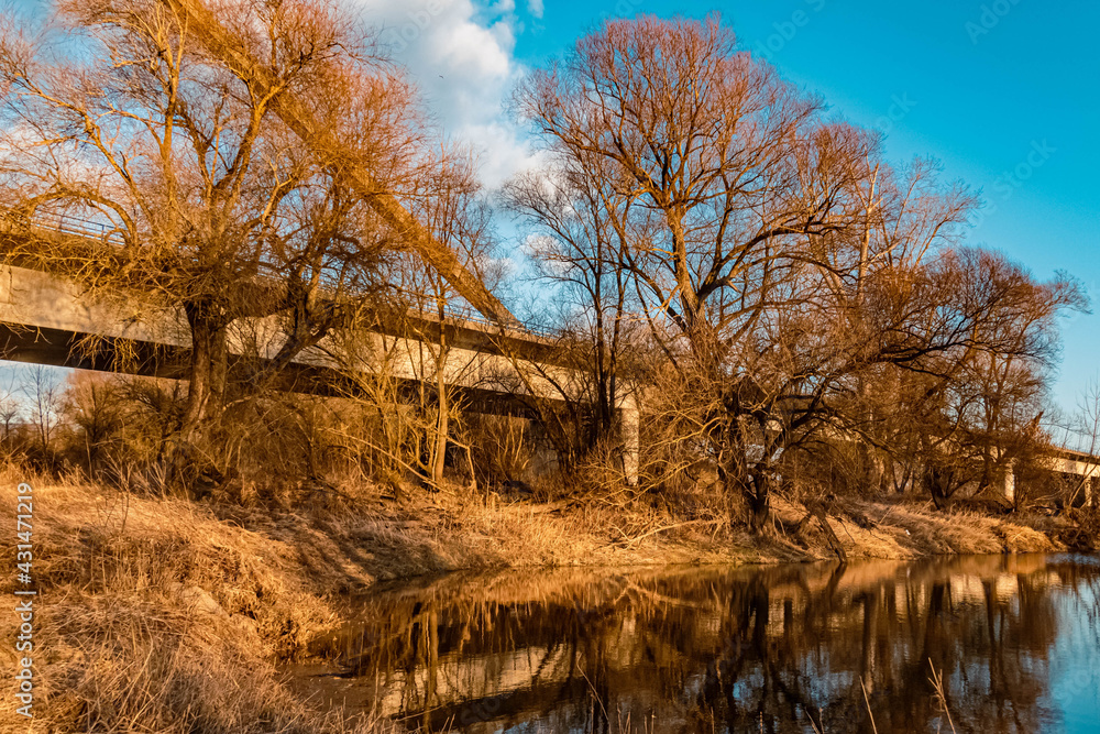 Beautiful sunny winter evening view with reflections near Mettenufer, Danube, Bavaria, Germany Beautiful sunny winter evening view with reflections near Mettenufer, Danube, Bavaria, Germany