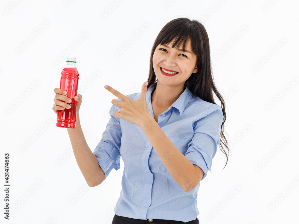 Beauty long-hair lady with charming smile and eyes in blue shirt. Look at camera right hand holding red vitamin bottle left finger point to that. Landscape half top body with white background Beauty long-hair lady with charming smile and eyes in blue shirt. Look at camera right hand holding red vitamin bottle left finger point to that. Landscape half top body with white background