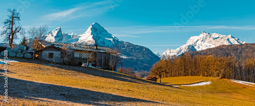 Beautiful alpine winter view on a sunny day with the famous Watzmann and Hochkalter summits in the background near Berchtesgaden, Bavaria, Germany