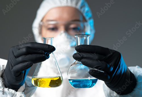 A chemist in a protective s...
