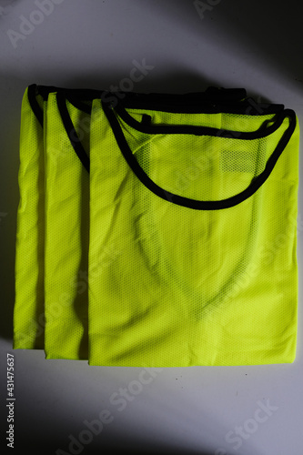 several light green football coaching bibs