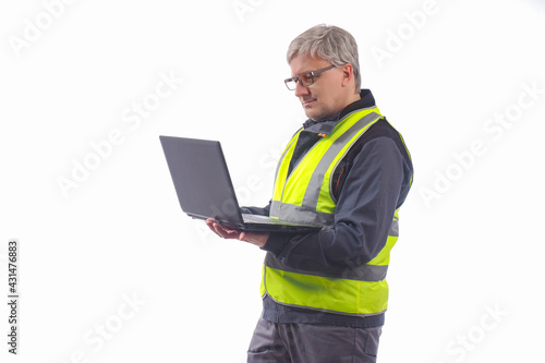 A man in work clothes is ho...