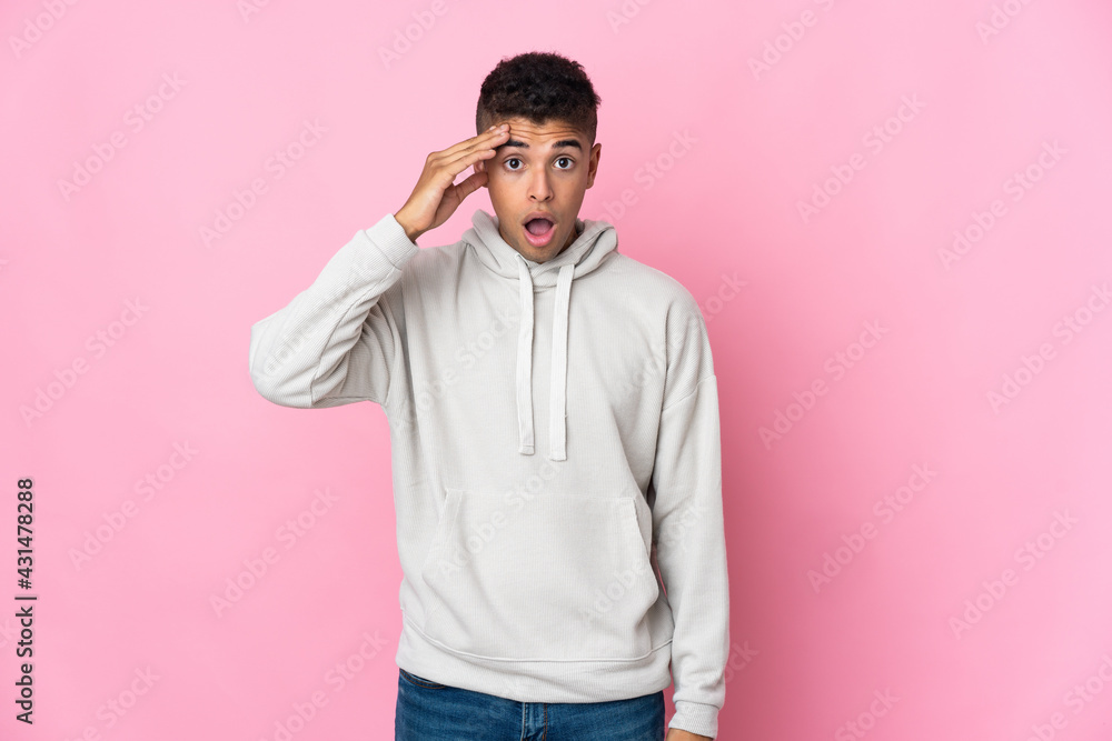 Young Brazilian man isolated on pink background has realized something and intending the solution Young Brazilian man isolated on pink background has realized something and intending the solution