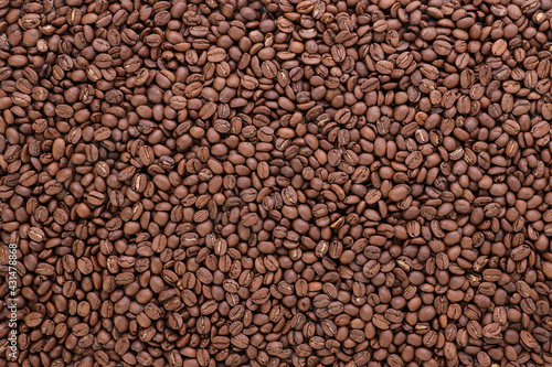 Freshly roasted coffee beans background top view using for your advertising